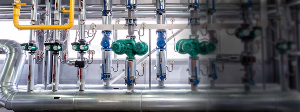 interior of an industrial boiler, the piping, pumps and motors