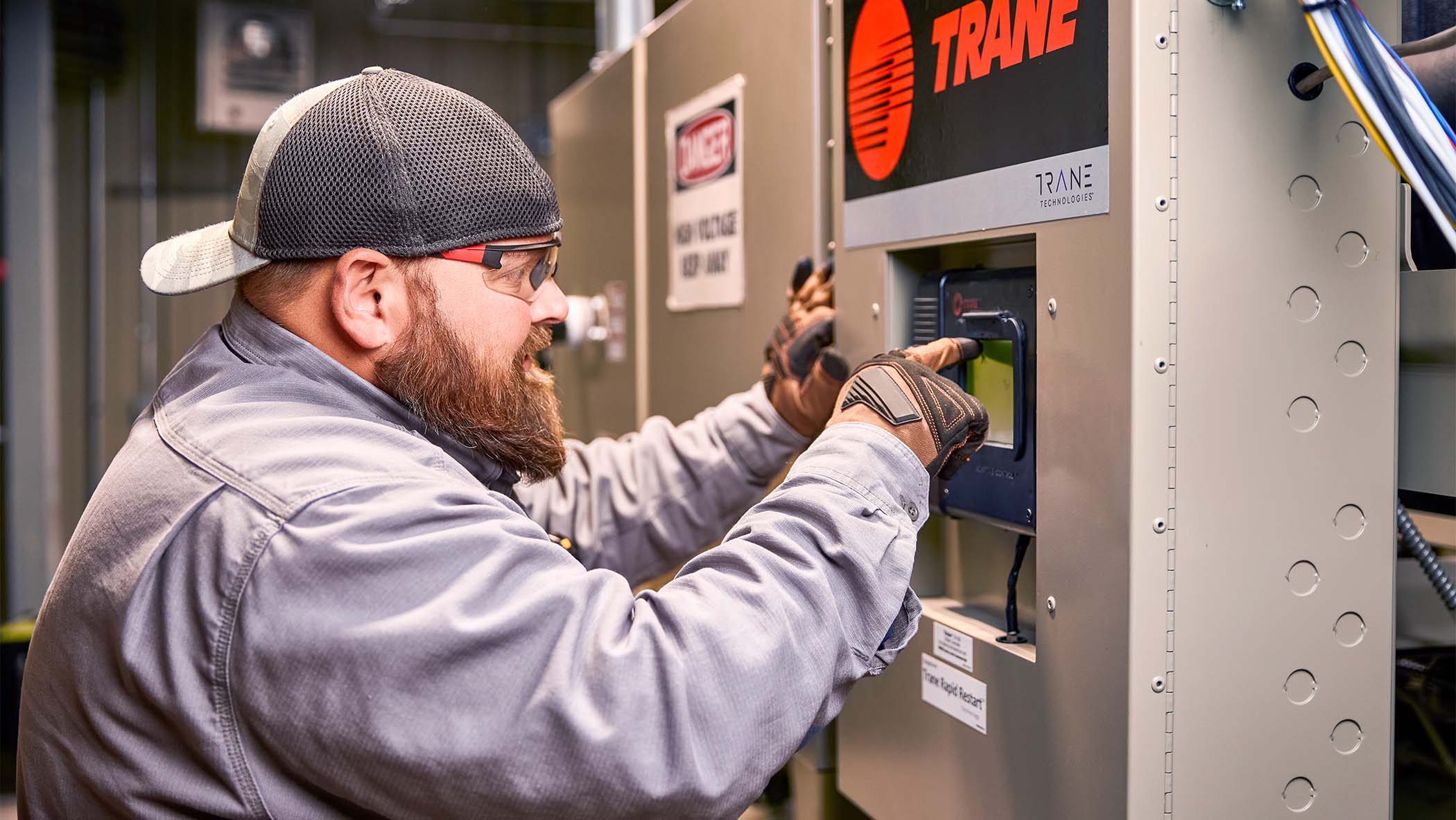 A Trane-certified technician repairs an HVAC unit